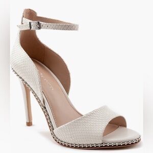 Embossed ankle strap heels